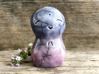 A smiley, loving, and very happy Jizo Shinto raku ceramic sculpture talisman glazed in a bottom-to-top gradient of purple and violet. A wonderful smooth shape to hold in the hand.