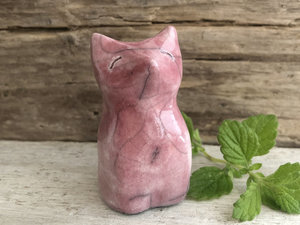 A sweet Shinto Inari kitsune fox kami raku ceramic palm talisman glazed in a soft red-pink.