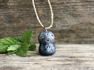 Blue raku ceramic smiley Jizo pendant strung on adjustable eco flax cord.