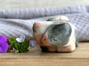 Little raku ceramic cat spirit kami sculpture glazed in a calico pattern (warm orange, grey, and white) and with a kind, gentle face.