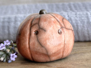 Slightly suspicious rustic pumpkin guardian sculpture for Halloween, Samhain, autumn, fall