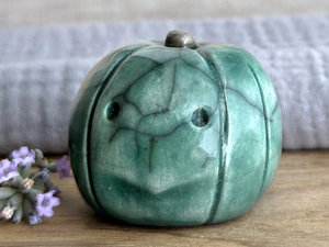 Concerned and significant pumpkin guardian spirit sculpture for Halloween, Samhain, autumn, fall