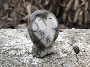 Ceramic raku owl kami nature spirit sculpture with a heart-shaped face. Lovely guardian statue for Shinto kamidana shrine, shamanism, pagan altar, or rewilding.