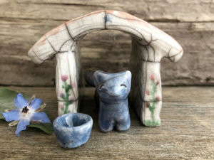 Small blue and brown raku ceramic Shinto Inari kitsune fox kami sculpture with his very own little ceramic house and blue wishing bowl. The house is glazed to look like it has a terracotta tiled roof and flowers growing up its white walls. A perfect mini shrine.