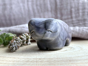 Ceramic raku bear kami sculpture glazed in a nose-to-tail gradient of grey-blue to soft grey-violet. It has a kind, gentle face.