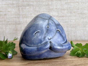 A smiley, loving, and very happy Jizo Shinto raku ceramic sculpture glazed in blue with sweet little praying hands.