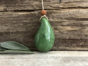 Calm worry pendant w/ sandalwood (green) in raku ceramic | adjustable eco flax cord | stress talisman, fidget, sensory jewellery gift