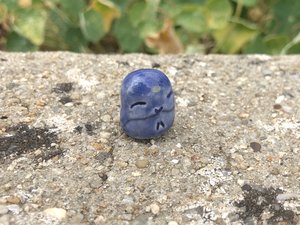 Pocket-sized tiny Jizo ceramic raku Shinto statue sculpture glazed in blue with a yellow dot over his third eye.