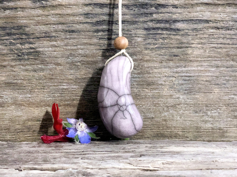 Thumbstone worry pendant w/ sandalwood (pale purple) on eco flax cord