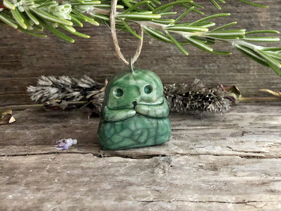 Raku ceramic kodama nature and tree spirit sculpture with impressive raku crackling. He's glazed in shades of green, and he has a kind, gentle face and sweet little arms.