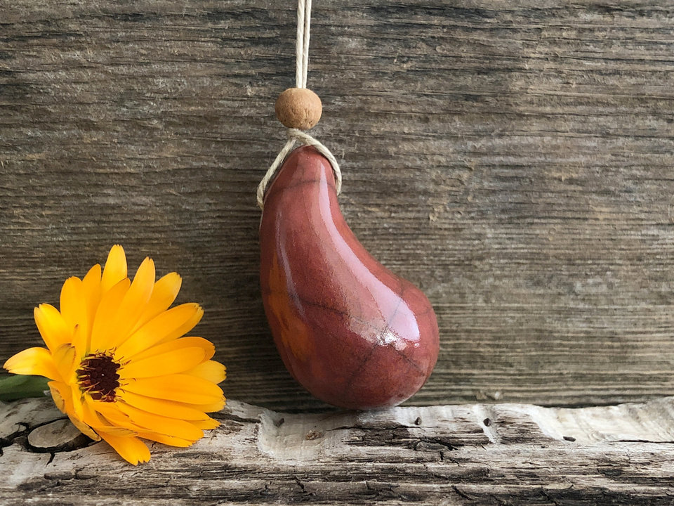 Calming worry pendant w/ sandalwood (red-orange) in raku ceramic | adjustable eco flax cord | stress talisman, fidget, sensory jewellery