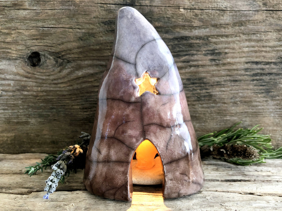 Raku spirit cave with lots of lovely windows (including a star-shaped one). It's glazed in a gradient from warm brown through soft mauve to indigo-violet (bottom to top).