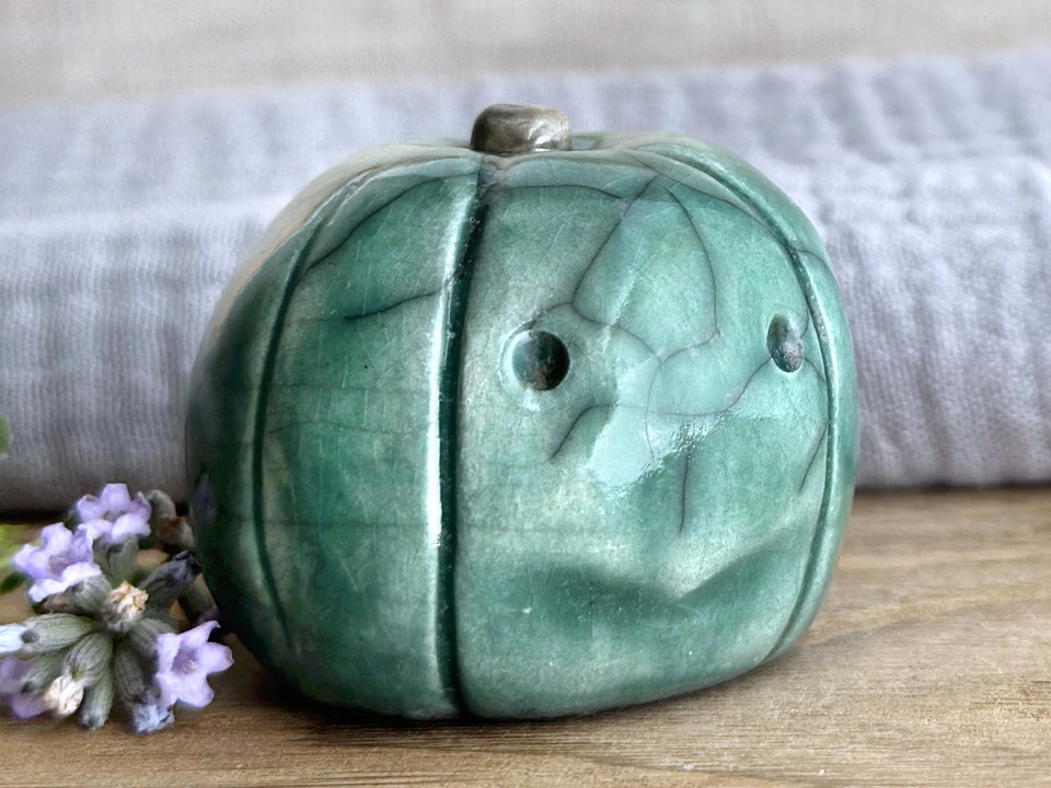 Concerned and significant pumpkin guardian spirit sculpture for Halloween, Samhain, autumn, fall