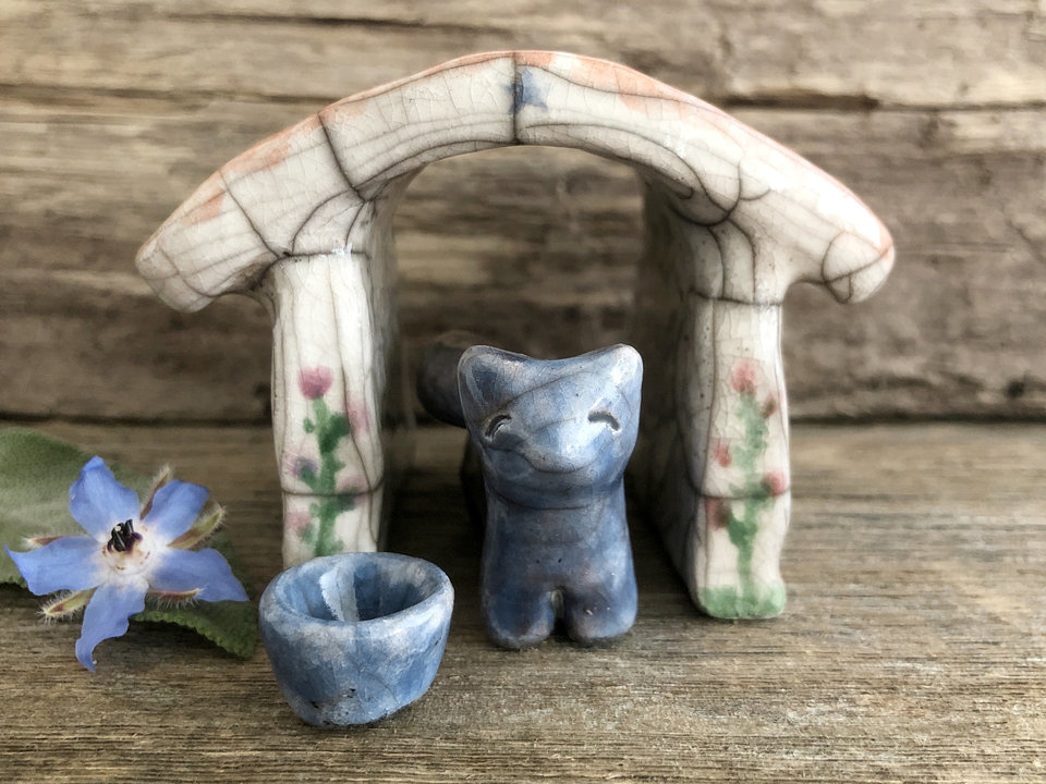 Small blue and brown raku ceramic Shinto Inari kitsune fox kami sculpture with his very own little ceramic house and blue wishing bowl. The house is glazed to look like it has a terracotta tiled roof and flowers growing up its white walls. A perfect mini shrine.