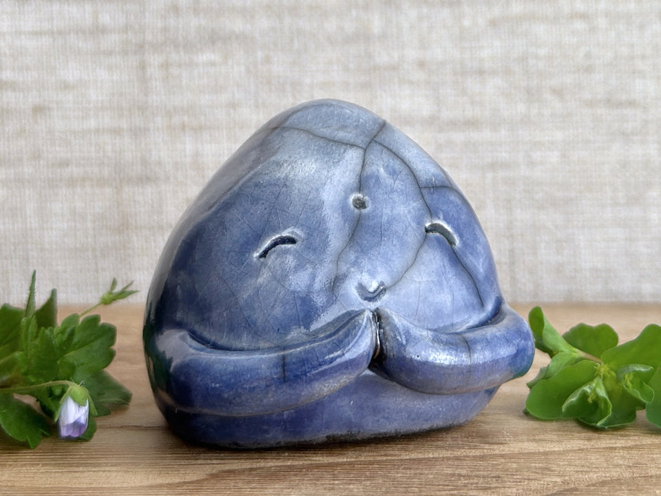 A smiley, loving, and very happy Jizo Shinto raku ceramic sculpture glazed in blue with sweet little praying hands.