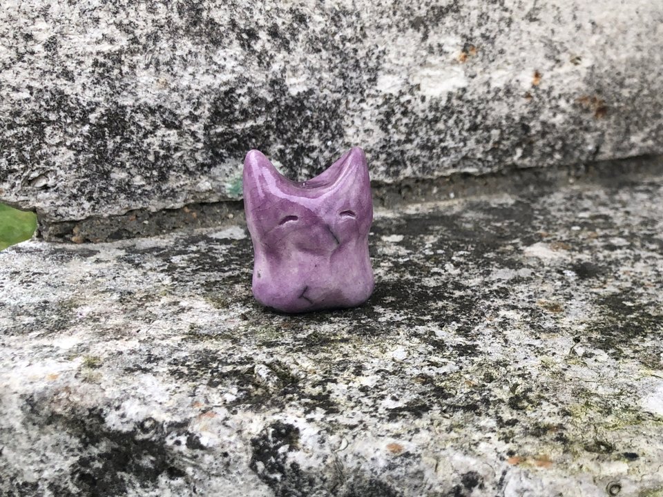 Ceramic raku earth elemental kami nature spirit sculpture glazed in mauve. She has pointed ears and a kind face, lovely for a Shinto shrine, shamanism, or rewilding.