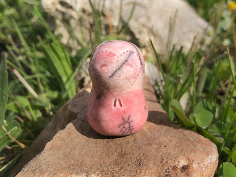 A smiley and loving Jizo Shinto raku ceramic sculpture talisman in pink with a heart face. A wonderful smooth shape to hold in the hand.