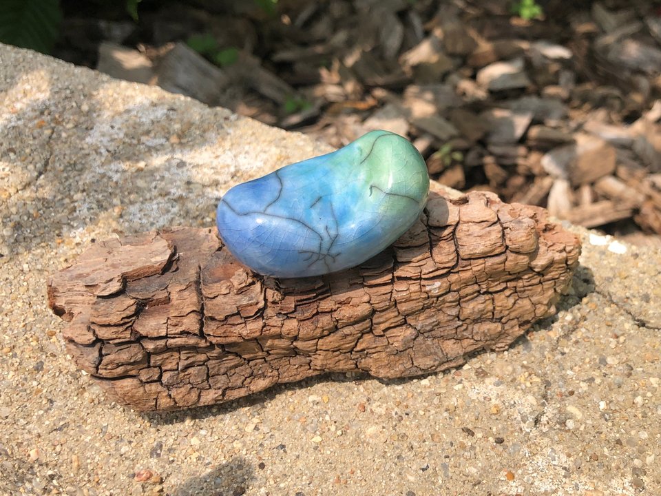 Child of the sea on driftwood, water ocean elemental kami nature spirit | Shinto shrine, Shamanism, pagan raku statue | rewilding