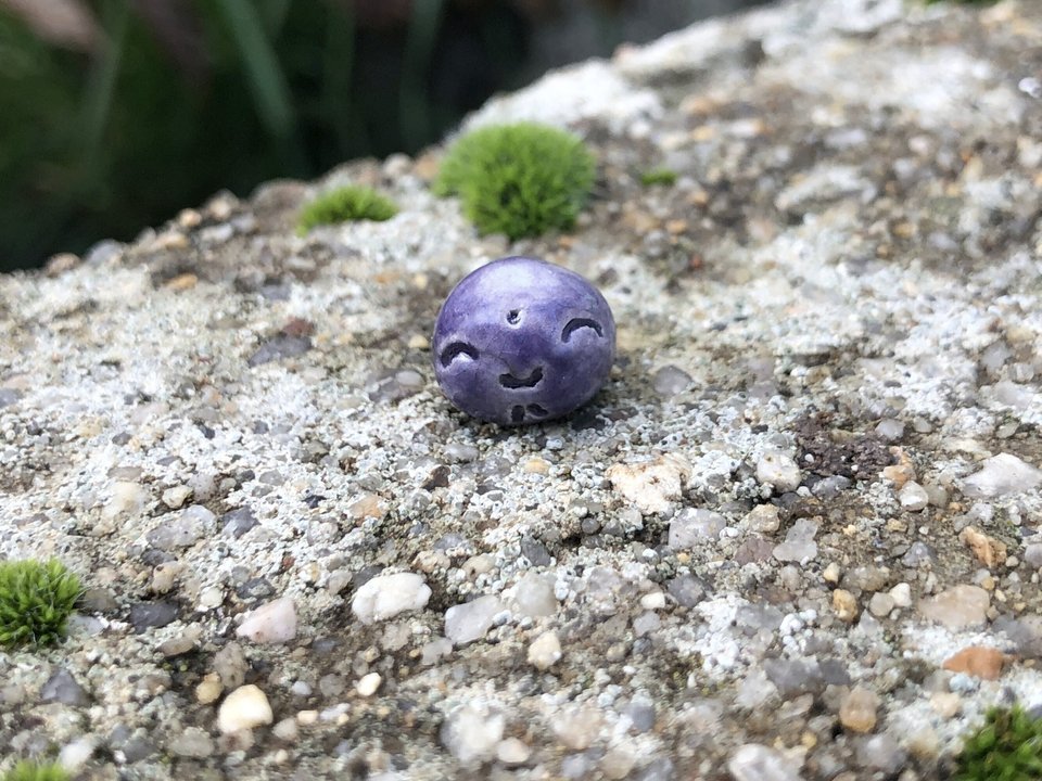 Super tiny Jizo ceramic raku Shinto statue sculpture glazed in violet. Very smiley, happy, and loving for a shrine or kamidana.