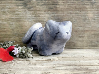 Little raku ceramic cat spirit kami sculpture glazed in a soft indigo-violet colour and with a kind, gentle face.