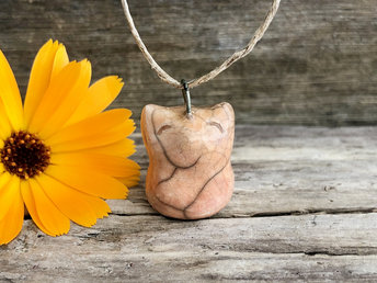 Soft peachy orange raku ceramic happy kitsune fox pendant strung on adjustable eco flax cord.