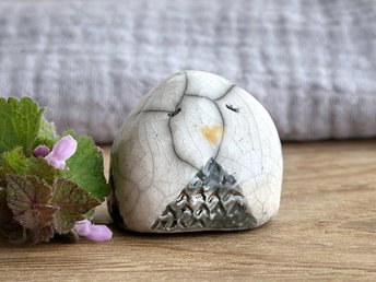 Raku ceramic little owl or owlet kami nature spirit statue glazed in white and grey with gentle, sleepy eyes and a little golden yellow beak.