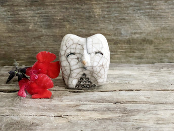 Raku ceramic little owl or owlet kami nature spirit statue glazed in white and grey-brown with impressive raku crackling, happy eyes, and a little orange beak.