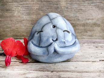 A smiley, loving, and very happy Jizo Shinto raku ceramic sculpture glazed in soft blue with sweet little praying hands.