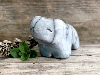 Ceramic raku bear kami sculpture glazed in pale blue with a hint of aqua. It has a kind, gentle face.