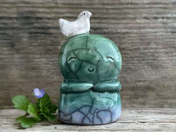 Shinto Jizo nature spirit guardian ceramic statue glazed in a bottom-to-top gradient of blue and green with a happy, smiley face, little praying hands, and a sweet white bird on their head.