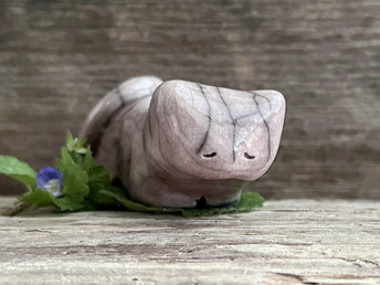 Little raku ceramic cat spirit kami sculpture glazed in a pale pink colour and with a gentle and very sleepy face.