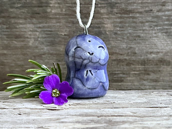 raku ceramic smiley Jizo pendant, glazed in indigo violet and strung on adjustable eco hemp cord.
