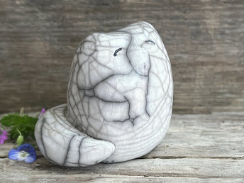 A kind and gentle and quite chonky fox kitsune kami spirit ceramic raku statue glazed in white.