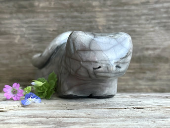 Little raku ceramic cat spirit kami sculpture glazed in grey with soft hints of mauve pink. It has a kind, gentle, sleepy face.