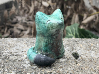 Ceramic raku Shinto Inari kitsune fox kami sculpture glazed in copper-turquoise with a black tail. Friendly nature guardian spirit for kamidana shrine, shamanism, animal totem guide.