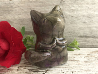Raku ceramic kitsune fox sculpture. She has sweet praying hands and a gentle, upturned face. She is glazed in grey-brown with mauve pink on her tail and lower half.
