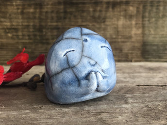 A smiley, loving, and very happy Jizo Shinto raku ceramic sculpture talisman glazed in soft blue with sweet little praying hands.