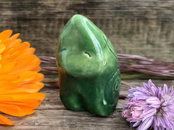 Raku ceramic sculpture of an elemental earth spirit gnome. He is very gentle and glazed in green with Celtic spiral decorations.