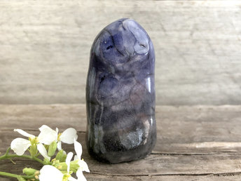 Raku ceramic standing statue of a nature spirit of dusk. He is glazed in soft grey and violet and looks very peaceful.