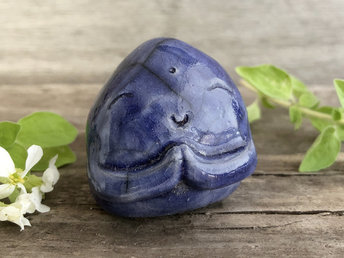 A smiley, loving, and very happy Jizo Shinto raku ceramic sculpture talisman glazed in blue with sweet little praying hands.