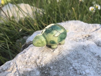 Ceramic raku little turtle kami nature spirit sculpture. It is glazed in green with dark green patches on its back. Lovely animal totem guide for Shinto or shamanism.