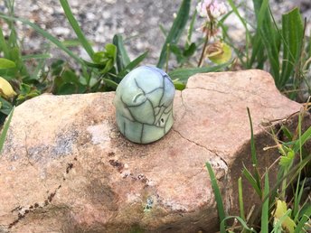 A sweet little kodama nature and forest spirit kami ceramic raku sculpture glazed in pale green and blue with a happy, gentle smiling face. Lovely for a Shinto kamidana shrine, pagan altar, shamanism.