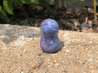 A smiley, loving, and very happy Jizo Shinto raku ceramic sculpture talisman in shades of blue, violet, and purple. A wonderful smooth shape to hold in the hand. Jizo is known for protection, hope, and help with anxiety.