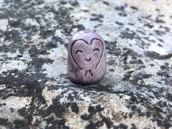 Pocket-sized tiny Jizo ceramic raku Shinto statue sculpture glazed in pale purple with a heart shape around his face.