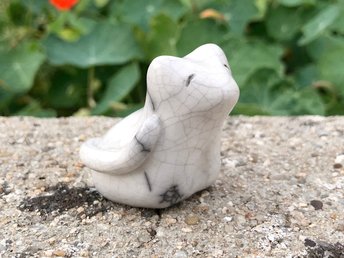 White raku ceramic sculpture of a sitting cat. She is a very sweet statue for a Shinto shrine, shamanism, or as an animal totem guide.