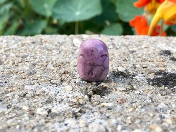 Pocket-sized tiny Jizo ceramic raku Shinto statue sculpture glazed in mauve purple.
