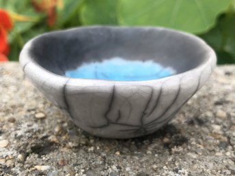 Small raku ceramic offering, ceremony, or wishing bowl with white glaze on the outisde and turquoise colour and unglazed black on the inside. Cannot hold water! Lovely for Shinto, wishing, shamamism, intention, pagan.