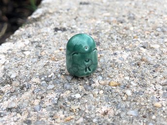 Pocket-sized tiny Jizo ceramic raku Shinto statue sculpture glazed in pine green. Very smiley, happy, and loving for a shrine or kamidana.