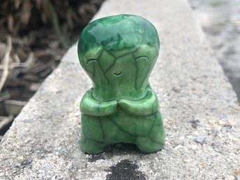 Green ceramic raku sculpture of a cabbage kami nature spirit with a sweet, smiling face. Lovely statue for Shinto shrine, shamanism, pagan, or a gift for a gardener.